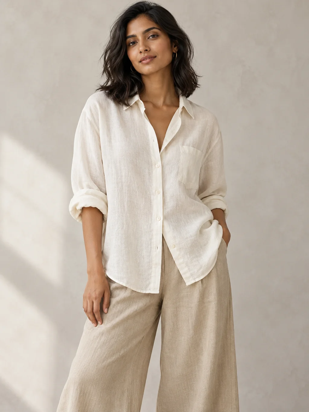 The Relaxed Linen Shirt in Ivory, worn by a model
